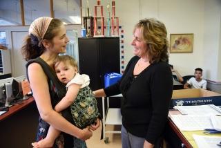 Chess teacher Elizabeth Spiegel (left) chats with Chapter Leader Pam Curcio. Spi