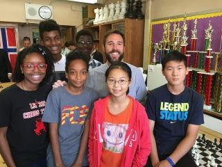 Social studies teacher Jeremiah Robie, who does logistics for the chess team’s t