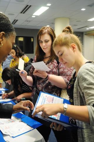 Women filling out forms