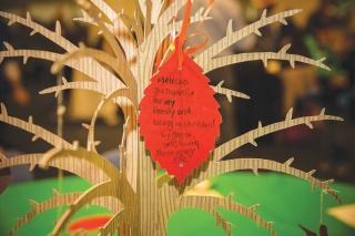 Notes of thankfulness were written by children and hung on the tree centerpieces
