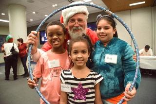 Youngsters get framed with Santa — former UFT Secretary Emil Pietromonaco, who n