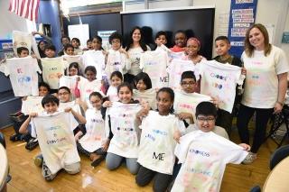 Students, with teachers Shari Kotler (back row, center) and Sue Kissin, show off