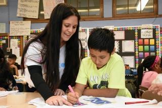 Kotler works with a student as he creates his shirt.