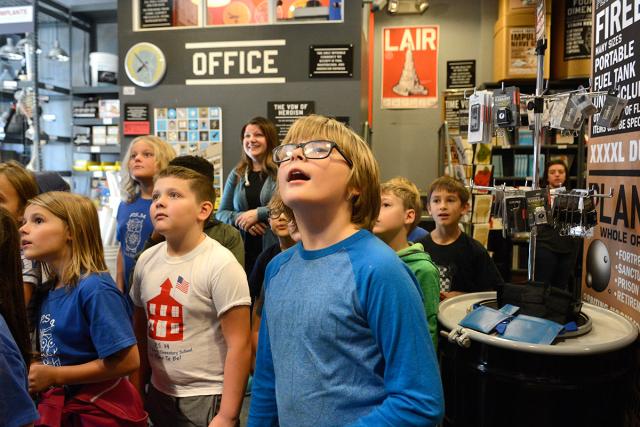 PS 34 students react with amazement as field-trip coordinator Kathleen Fletcher 