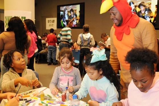 Chapter Advocate Rashad Brown dons a turkey costume to the delight of children d