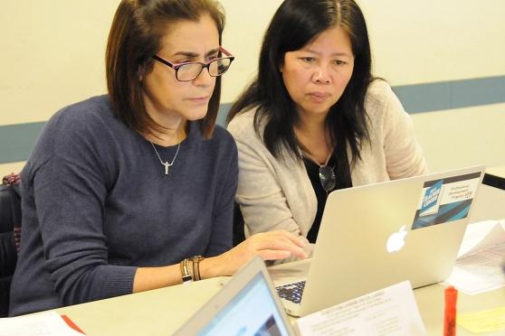 Paraprofessionals Suely Souto Maior (left) and Qi Dan Lei, from PS 503 in Brookl