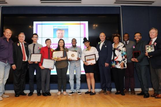 All the honorees take the stage with (from left) UFT President Michael Mulgrew a