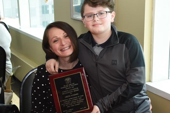 Christine McNamara from PS 23, a District 75 school in Queens, celebrates with h