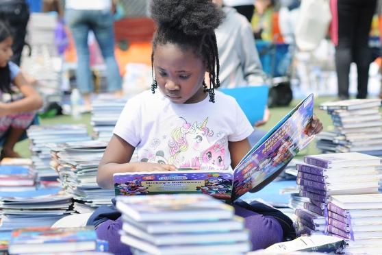 A 1st-grader reads a book.
