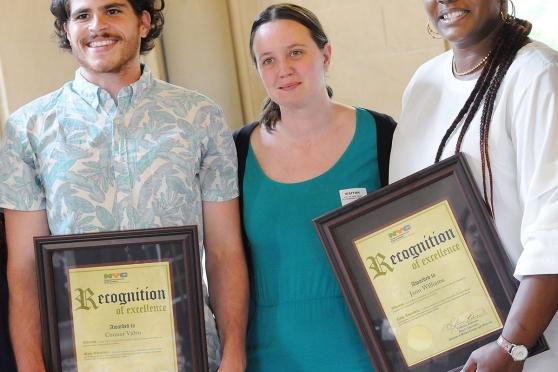 Kingsborough Early College Secondary School teacher Elizabeth Kullman is flanked