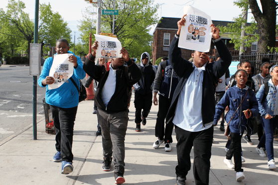 Students march outside of IS 285 Meyer Levin School for the Performing Arts in E