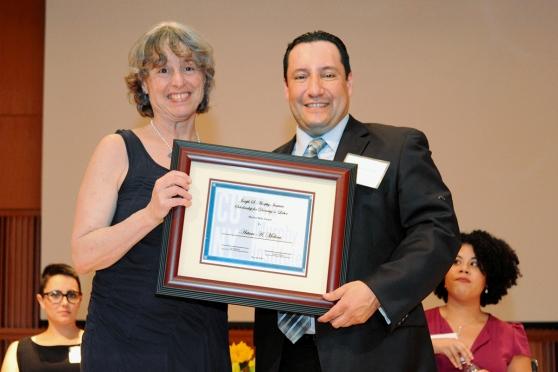Molina receives his award from Prof. Ruth Milkman of the Murphy Institute