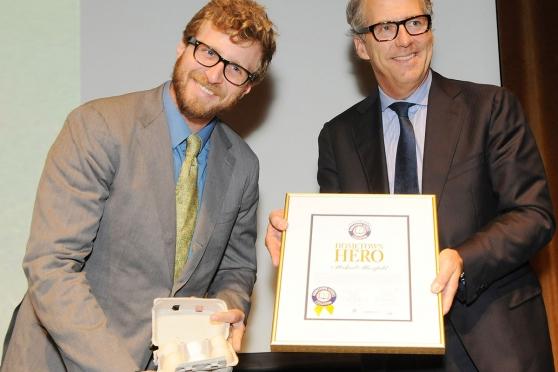 Masefield shows off a half-dozen eggs from his farm program as he receives his a
