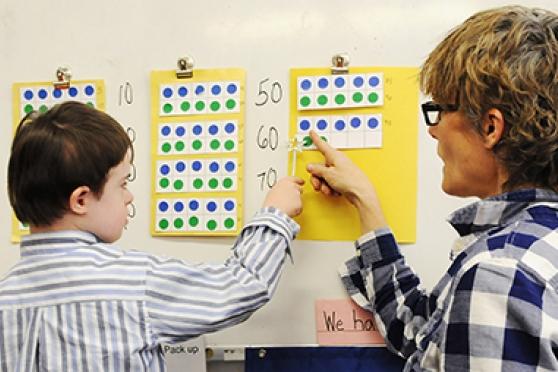 Seven-year-old Aedan counts his numbers by tens in Kreusch’s general education kindergarten class at PS 3 in the West Village.