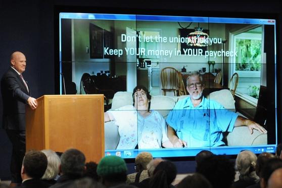 UFT President Michael Mulgrew watches delegates react to an anti-union video.