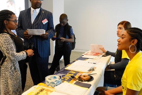 Committee member Charles Johnson and his children collect information at the NAA