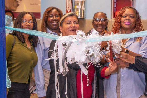 UFT Vice President for Education Evelyn DeJesus cuts the ribbon to open the new 