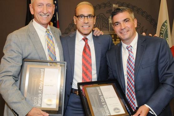 Staten Island Borough President James Oddo (center) presents the awards to Mohr 