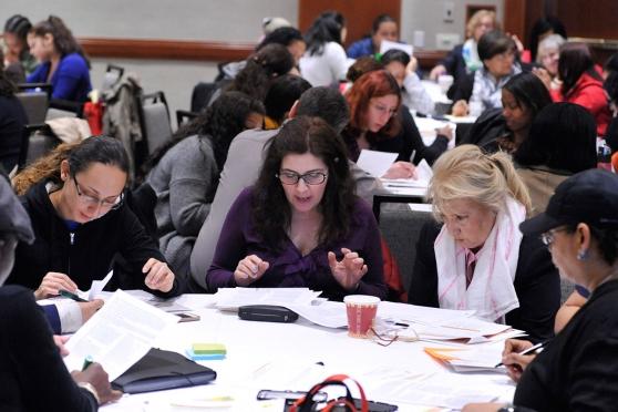 Educators focus on an exercise in the UFT Teacher Center workshop on understandi