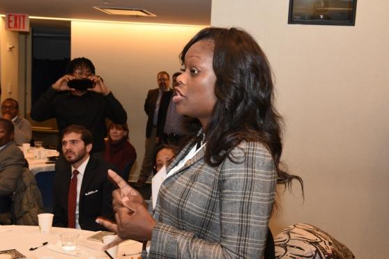 Assemblywoman Rodneyese Bichote speaking in front of people