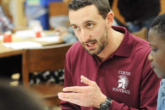 Joe Baratta, a teacher and success coach, tutors students who are football playe