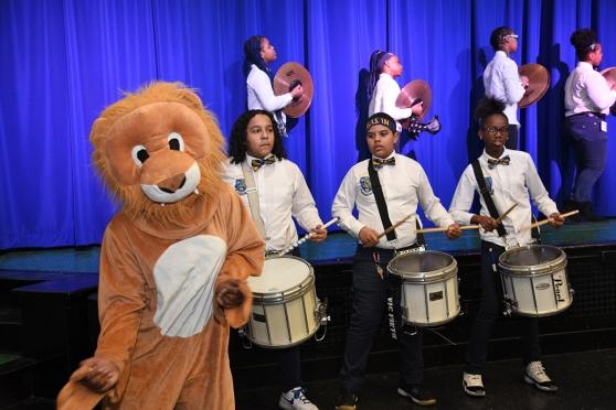 The PS/IS 184 mascot keeps the beat for the school’s drum line.