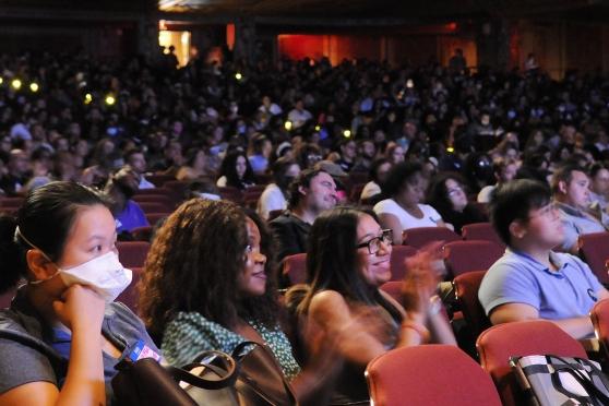 A crowd of members in a theatre 