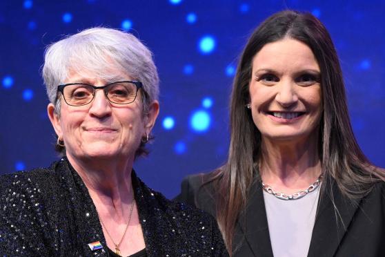 UFT District 79 Representative Patricia Crispino (left), standing next to NYSUT Executive Vice President Jaime Ciffone, receives top honors as the Sandy Feldman Outstanding Leadership Award-winner at the NYSUT RA.