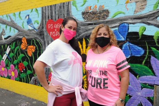  Chapter Leader Medina Selmanovic (left) and Principal Maria Guzman stand side by side for breast cancer awareness outside PS 46 in Brooklyn.
