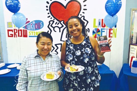 Jennie Chu (left) and Erika Wendler celebrate with cake at PS 171, Manhattan. 