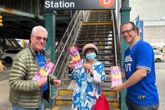 Three UFT members showing campaign literature