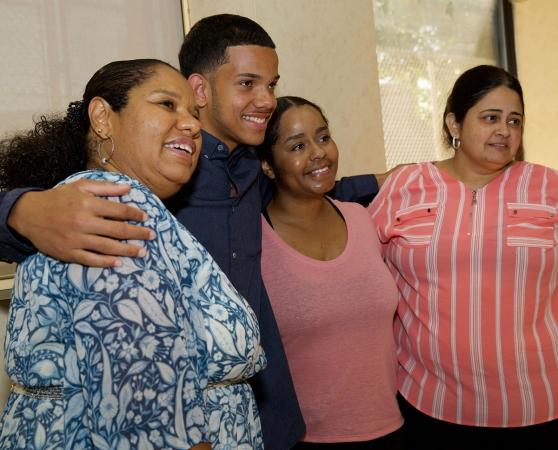 Award winner Louis Morel of Bronx Aerospace HS shares his happiness with (from l