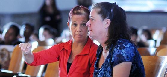 Dance teacher Kim Wojcieszek (left) and music teacher MaryAnn Spinner confer dur