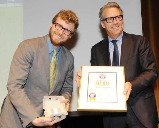 Masefield shows off a half-dozen eggs from his farm program as he receives his a
