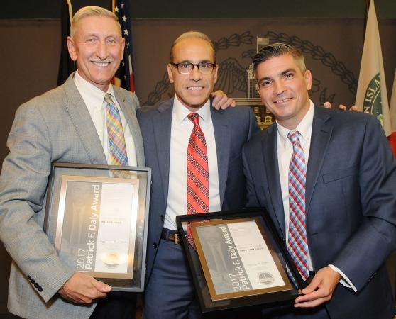 Staten Island Borough President James Oddo (center) presents the awards to Mohr 