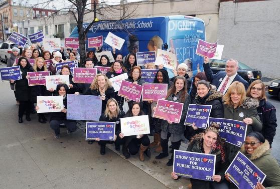 The staff of PS 239 in Ridgewood, Queens showed their love for public schools.