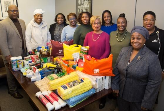 Members of the national and state chapters of the Black Caucus gather to celebrate the success of the group’s effort to collect items for displaced Bahamian students