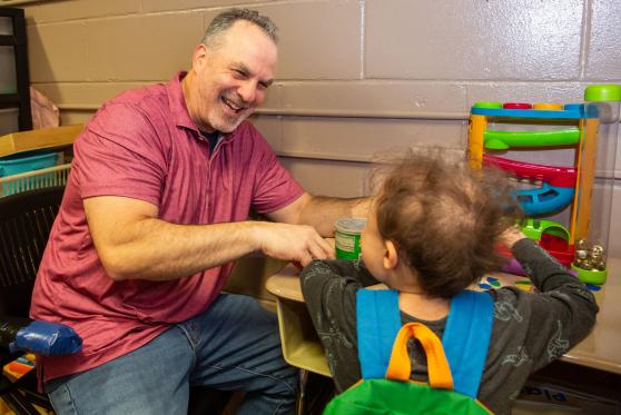 Occupational therapist Paul Kutchner works with a student at P4 @PS 179, a District 75 program in Fresh Meadows, Queens. 
