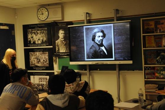An image of Frederick Douglass is presented to the class 