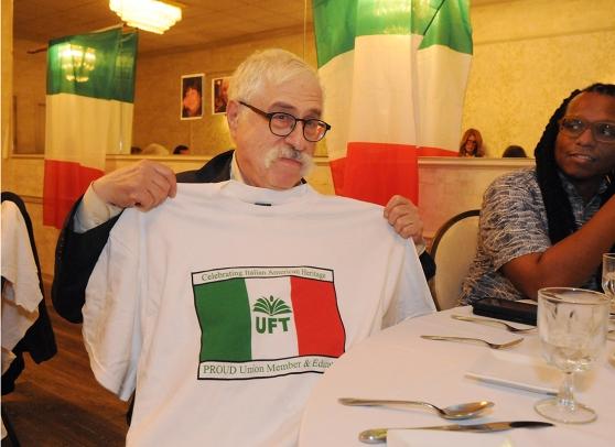 A man shows off his UFT Italian-American heritage committee t-shirt