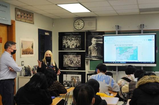 A teacher addressing the classroom 
