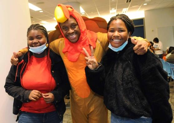 Students pose with a teacher in costume