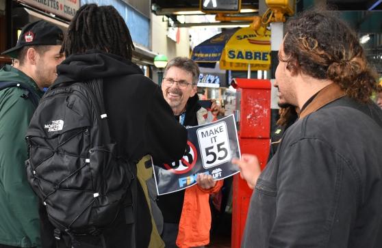 Rich Sherman (center, facing camera), a teacher and chapter leader at Validus Preparatory Academy in the Bronx, spreads the message to passersby in the Bronx about the importance of fixing Tier 6 on May 6, 2025. 