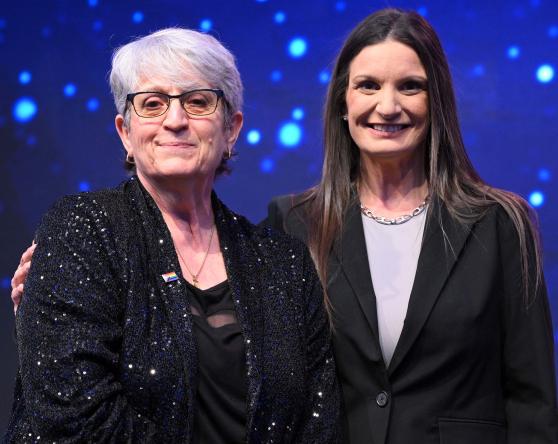 UFT District 79 Representative Patricia Crispino (left), standing next to NYSUT Executive Vice President Jaime Ciffone, receives top honors as the Sandy Feldman Outstanding Leadership Award-winner at the NYSUT RA.