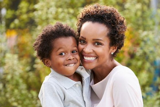 African American Mother and young son outside 