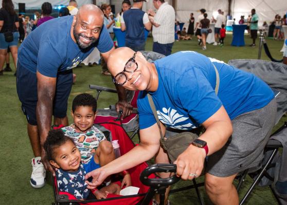 Physical education teacher Teresa Rodriguez-McGill, chapter leader at PS 183 in Queens, enjoys UFT Family Day with her husband, Michael McGill, who teaches at Liberty Avenue MS in Brooklyn, and their children.