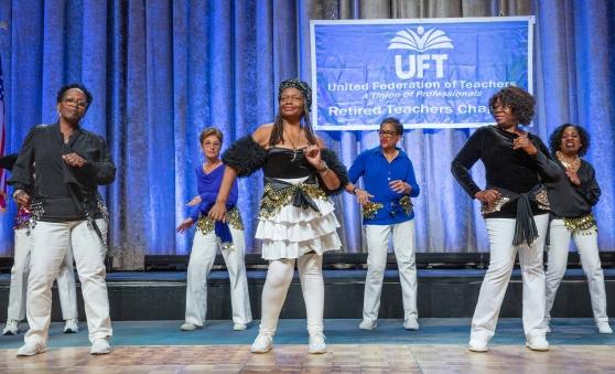 Retirees perform a dance move
