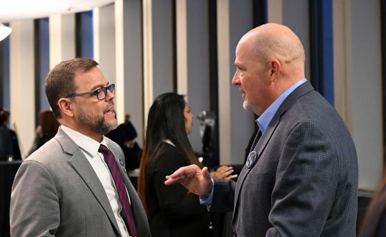 UFT President Michael Mulgrew (right) discusses union legislative priorities on behalf of the members during the UFT's legislative reception in Albany. 