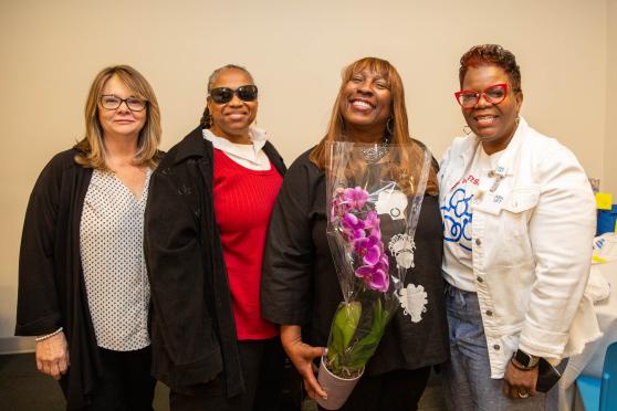 Four women pose for a photo 