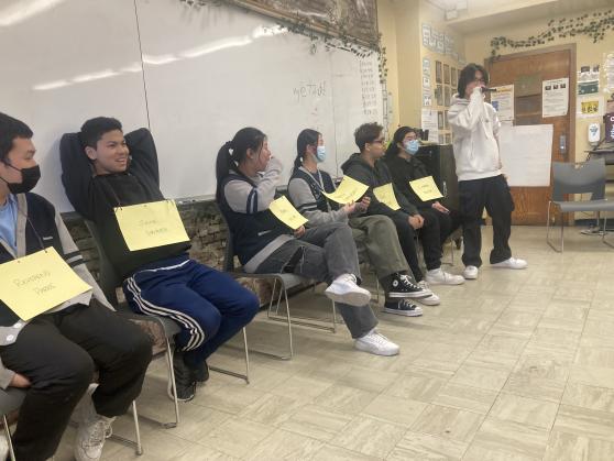 A group of students taking part in a classroom activity